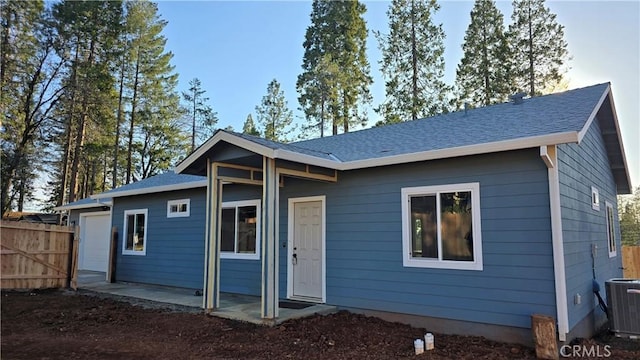 6485 Providence Ct, Magalia, CA 95954 - rear view of property featuring central AC unit and fence