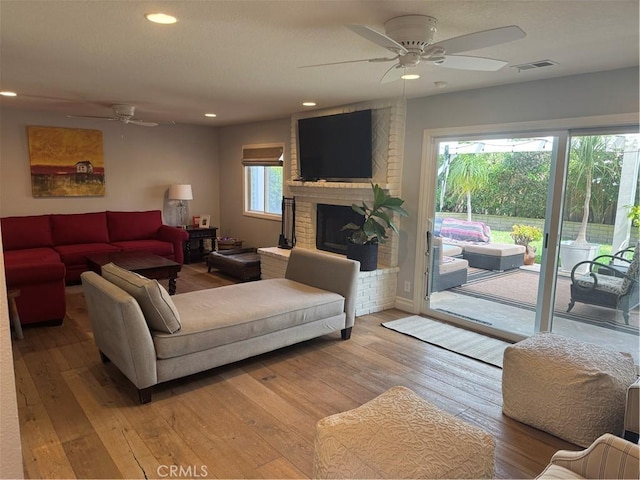 3108 Sumatra Pl, Costa Mesa, CA 92626 - living area featuring ceiling fan, light wood-type flooring, a brick fireplace, and recessed lighting