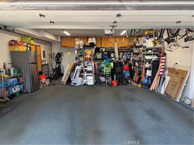3108 Sumatra Pl, Costa Mesa, CA 92626 - garage featuring freestanding refrigerator and a garage door opener