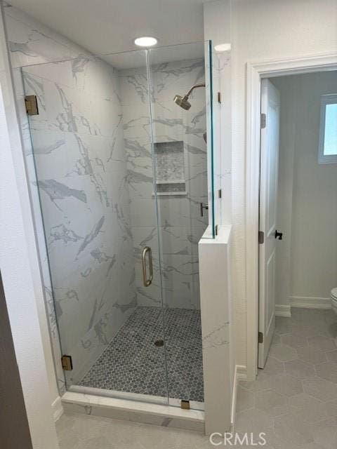 3108 Sumatra Pl, Costa Mesa, CA 92626 - bathroom featuring toilet, a marble finish shower, tile patterned floors, and baseboards