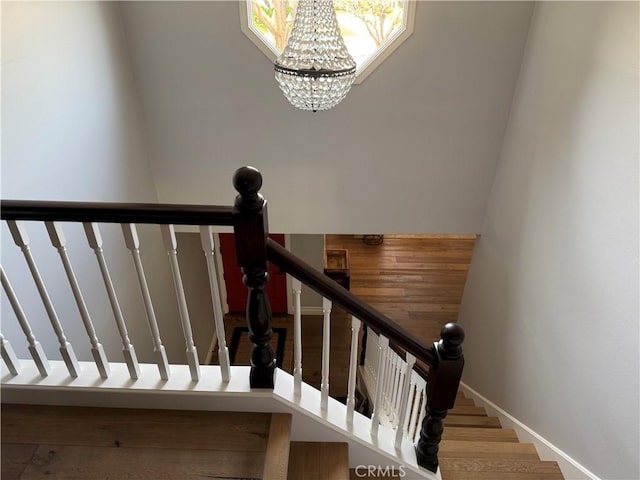 3108 Sumatra Pl, Costa Mesa, CA 92626 - stairway with a chandelier and baseboards