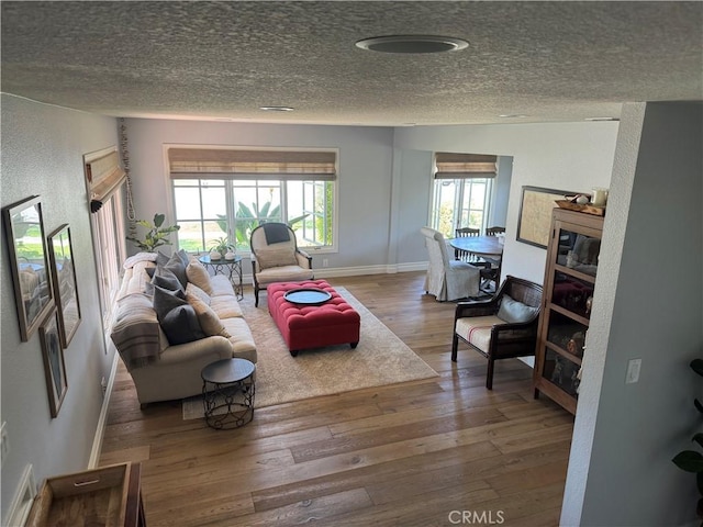 3108 Sumatra Pl, Costa Mesa, CA 92626 - living area with a textured ceiling, wood-type flooring, and baseboards