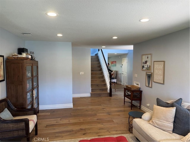 3108 Sumatra Pl, Costa Mesa, CA 92626 - living area with wood finished floors, stairway, baseboards, recessed lighting, and a textured ceiling