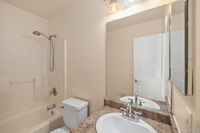 full bath featuring toilet, washtub / shower combination, and vanity
