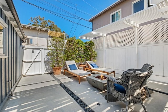 202 Onyx Ave, Newport Beach, CA 92662 - fenced backyard featuring a patio, an outdoor fire pit, and a gate