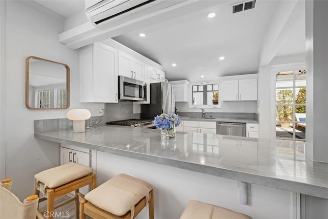 202 Onyx Ave, Newport Beach, CA 92662 - kitchen with stainless steel appliances, a sink, a peninsula, plenty of natural light, and recessed lighting