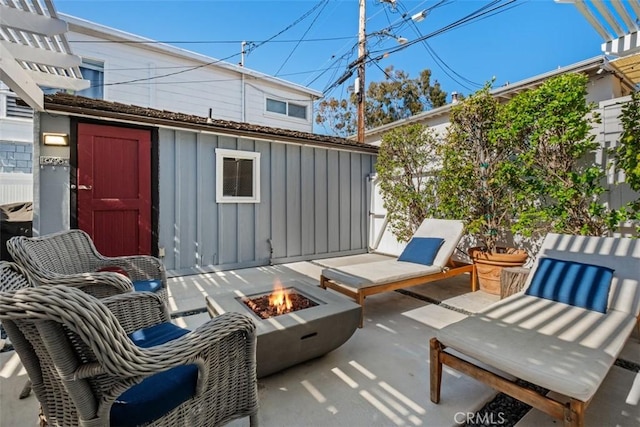 202 Onyx Ave, Newport Beach, CA 92662 - view of patio / terrace with an outdoor fire pit and an outbuilding
