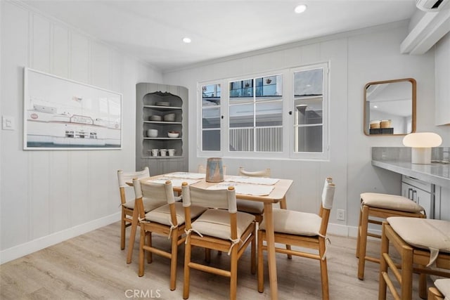 202 Onyx Ave, Newport Beach, CA 92662 - dining area with light wood-style floors, a decorative wall, crown molding, recessed lighting, and baseboards