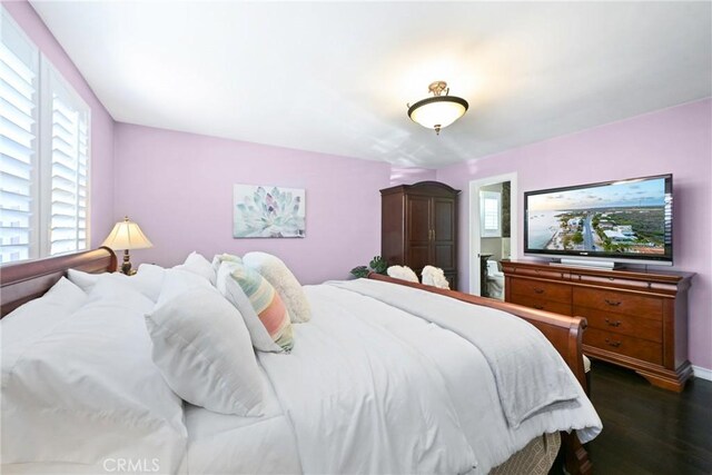 2018 Anaheim Ave, Costa Mesa, CA 92627 - bedroom with dark wood-style flooring, multiple windows, and baseboards
