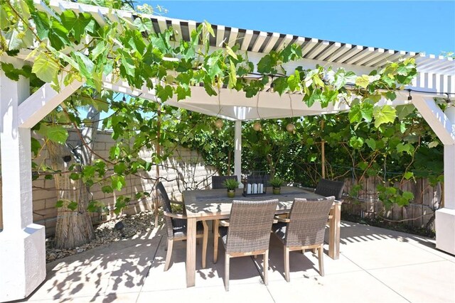 2018 Anaheim Ave, Costa Mesa, CA 92627 - fenced backyard with a pergola, a patio, and outdoor dining area