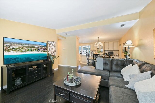 2018 Anaheim Ave, Costa Mesa, CA 92627 - living area with dark wood finished floors, a chandelier, and baseboards