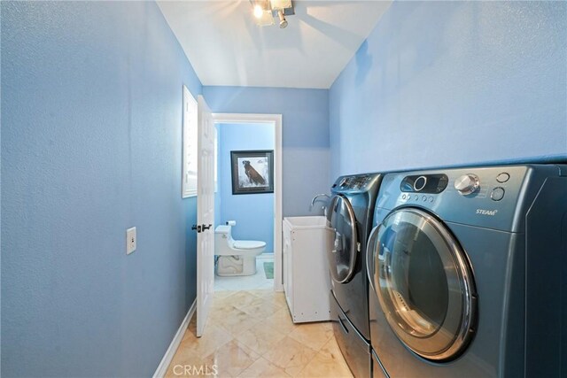 2018 Anaheim Ave, Costa Mesa, CA 92627 - washroom featuring independent washer and dryer and baseboards