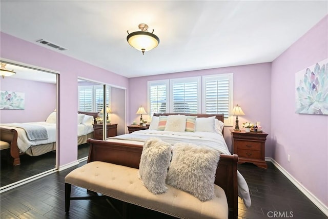 2018 Anaheim Ave, Costa Mesa, CA 92627 - bedroom featuring multiple closets, baseboards, and dark wood-type flooring