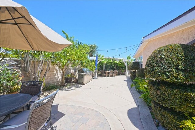 2018 Anaheim Ave, Costa Mesa, CA 92627 - fenced backyard featuring outdoor dining area, area for grilling, and a patio area