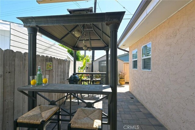 2018 Anaheim Ave, Costa Mesa, CA 92627 - view of patio with outdoor dining area and a gazebo