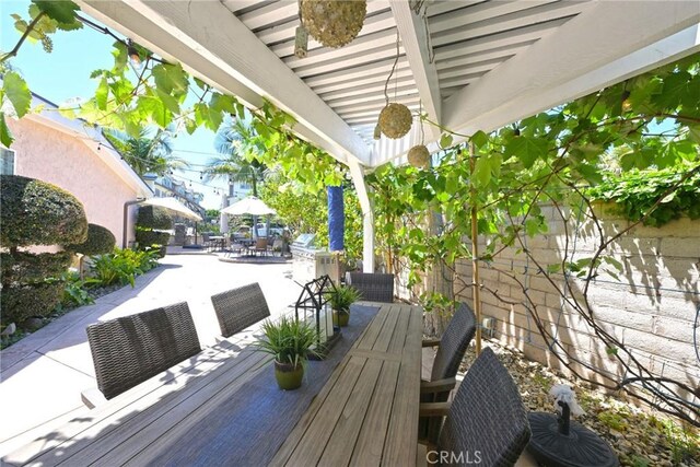 2018 Anaheim Ave, Costa Mesa, CA 92627 - wooden terrace featuring outdoor dining space and a patio