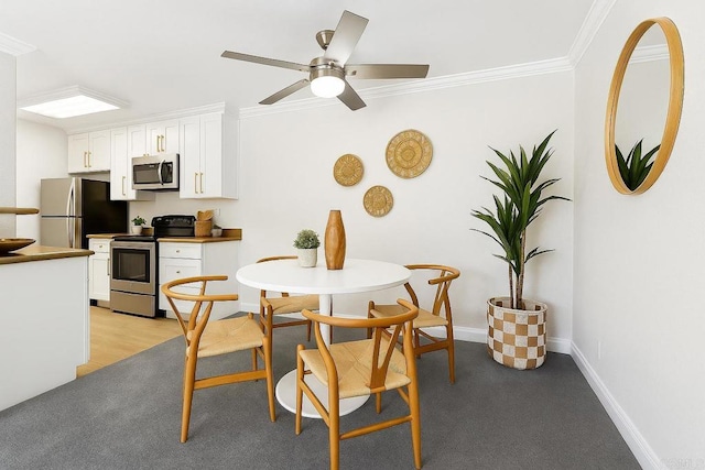 200 Chambers St Unit 19, El Cajon, CA 92020 - dining space featuring crown molding, baseboards, light carpet, and a ceiling fan