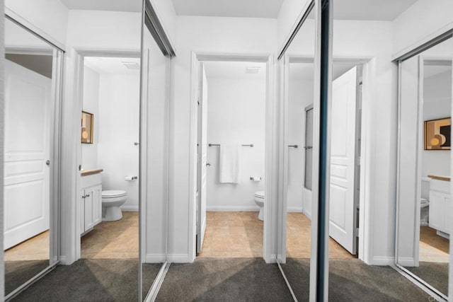 200 Chambers St Unit 19, El Cajon, CA 92020 - bathroom featuring toilet, vanity, and baseboards