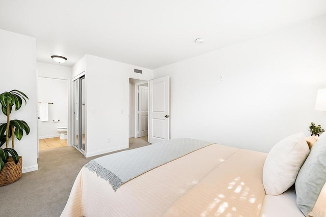 200 Chambers St Unit 19, El Cajon, CA 92020 - bedroom featuring light colored carpet, connected bathroom, and baseboards