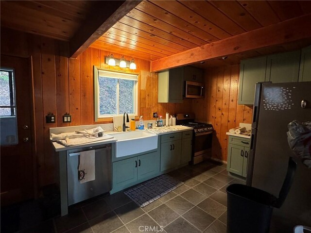 2548 Rim Of The World Dr, Running Springs, CA 92382 - kitchen featuring appliances with stainless steel finishes, wood ceiling, a sink, wooden walls, and beam ceiling