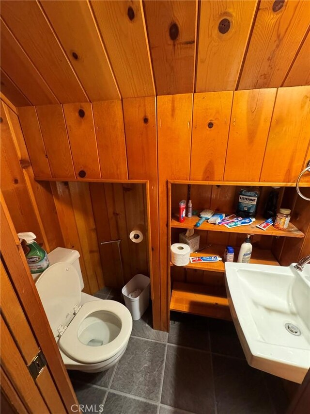 2548 Rim Of The World Dr, Running Springs, CA 92382 - bathroom with wooden ceiling, tile patterned floors, a sink, wood walls, and toilet