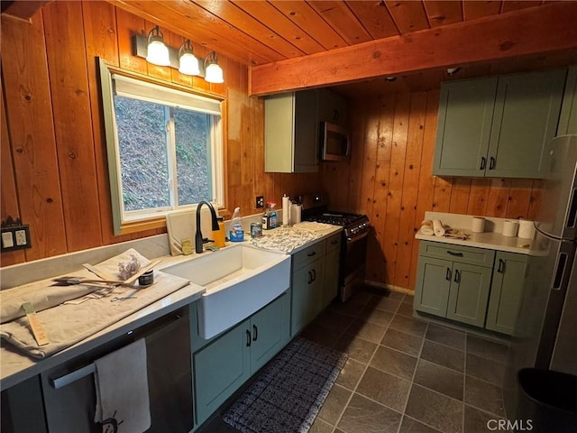 2548 Rim Of The World Dr, Running Springs, CA 92382 - kitchen featuring stainless steel appliances, a sink, wood walls, light countertops, and wooden ceiling