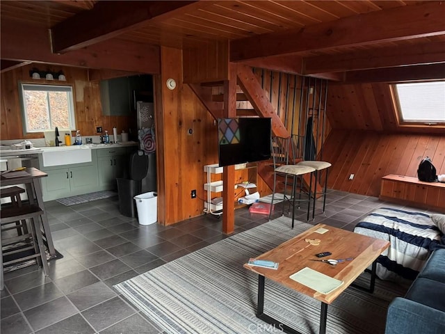 2548 Rim Of The World Dr, Running Springs, CA 92382 - living room with wood walls, beamed ceiling, stairway, dark tile patterned flooring, and wood ceiling