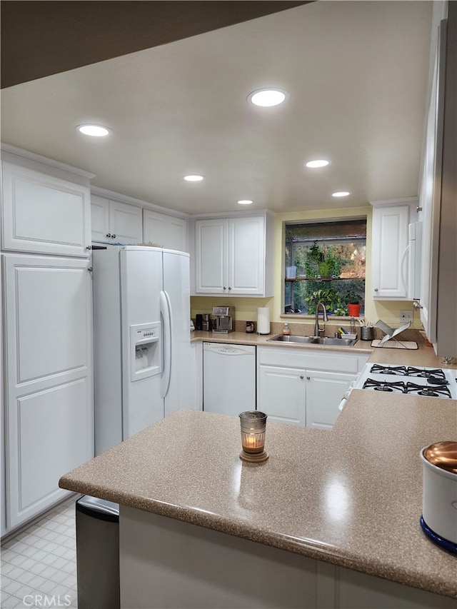 20334 Rue Crevier Unit 622, Canyon Country, CA 91351 - kitchen featuring white appliances, a sink, white cabinetry, recessed lighting, and light floors