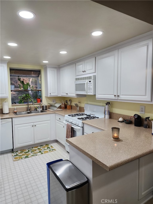 20334 Rue Crevier Unit 622, Canyon Country, CA 91351 - kitchen with white appliances, a sink, white cabinets, recessed lighting, and light countertops