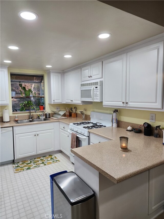 20334 Rue Crevier Unit 622, Canyon Country, CA 91351 - kitchen with white appliances, a sink, white cabinetry, recessed lighting, and light countertops