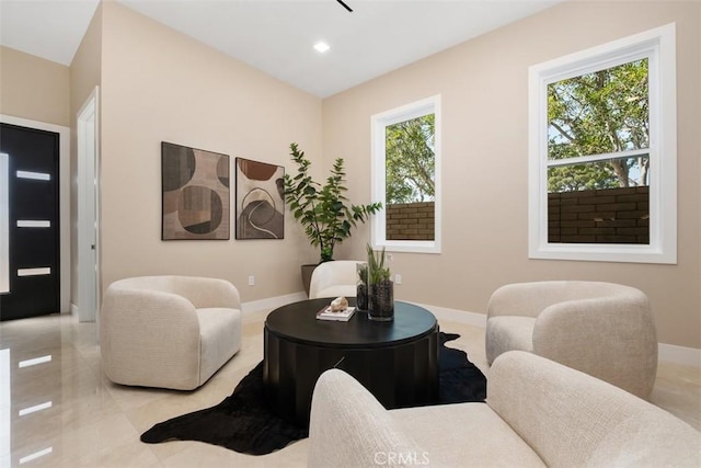 sitting room with baseboards and recessed lighting