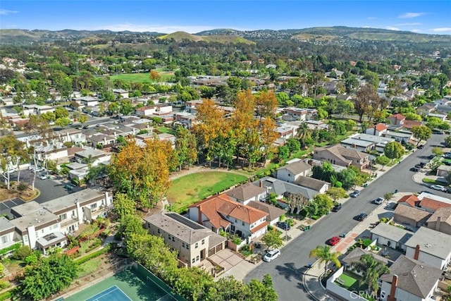 aerial perspective of suburban area featuring a mountain backdrop