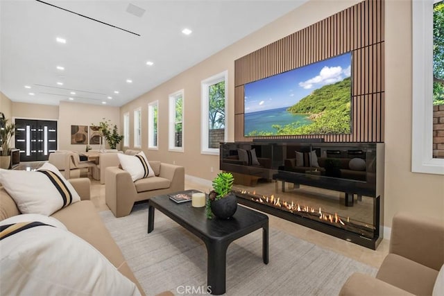 living room featuring recessed lighting and baseboards