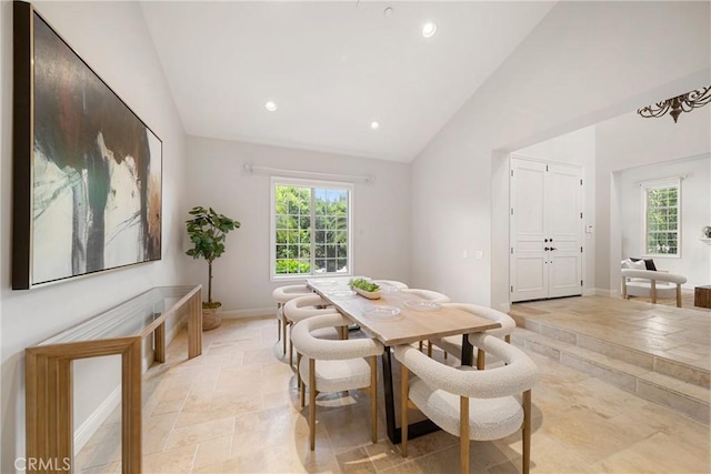 15850 Seville Ln, Encino, CA 91436 - dining room with stone tile floors, plenty of natural light, recessed lighting, baseboards, and high vaulted ceiling