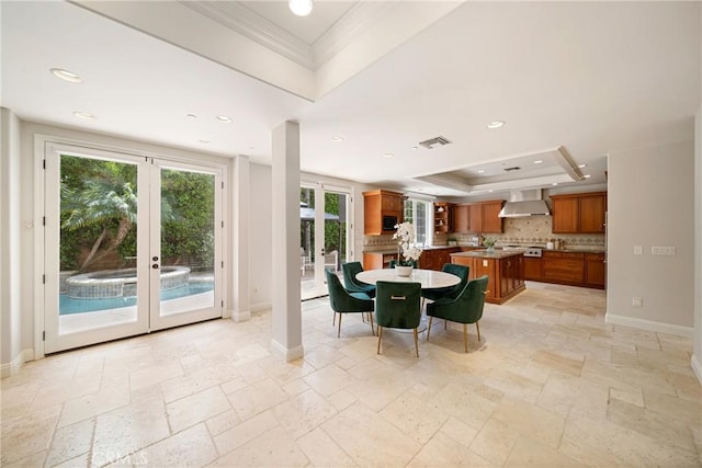 15850 Seville Ln, Encino, CA 91436 - dining room with a tray ceiling, french doors, stone tile floors, crown molding, and baseboards