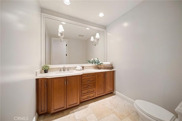 15850 Seville Ln, Encino, CA 91436 - bathroom featuring baseboards, vanity, toilet, and recessed lighting