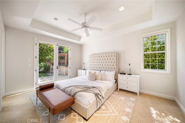 15850 Seville Ln, Encino, CA 91436 - bedroom with a tray ceiling, access to outside, baseboards, french doors, and a ceiling fan