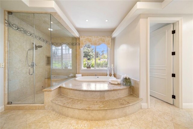 15850 Seville Ln, Encino, CA 91436 - bathroom featuring a shower stall, a garden tub, baseboards, and recessed lighting