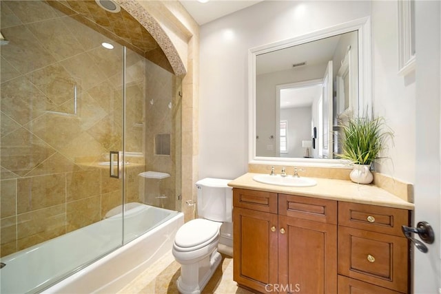15850 Seville Ln, Encino, CA 91436 - bathroom with toilet, vanity, and combined bath / shower with glass door