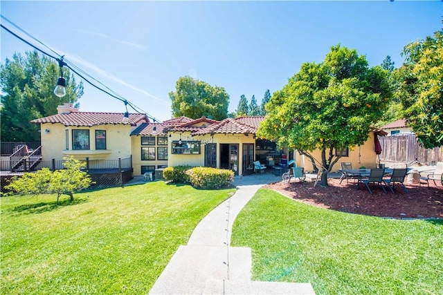 9092 S Rama St, Villa Park, CA 92861 - back of house featuring stucco siding and a tiled roof