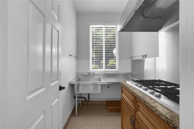 1541 Diamond Ct, Diamond Bar, CA 91765 - kitchen with range hood, brown cabinets, stainless steel gas stovetop, and light tile patterned floors