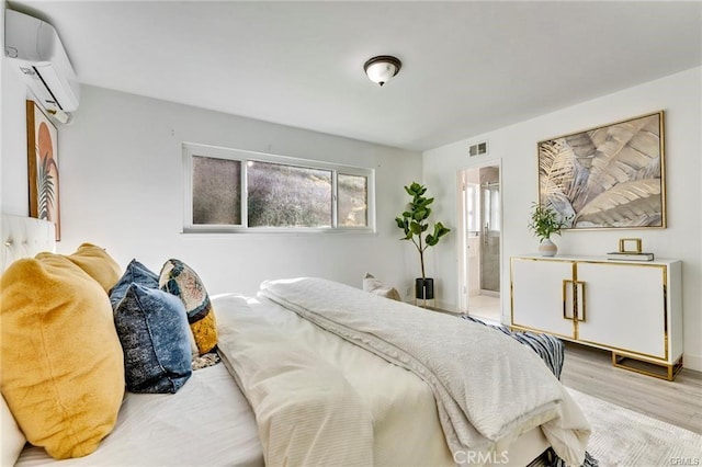 212 Macalester Dr, Walnut, CA 91789 - bedroom featuring a wall mounted air conditioner, wood finished floors, and baseboards