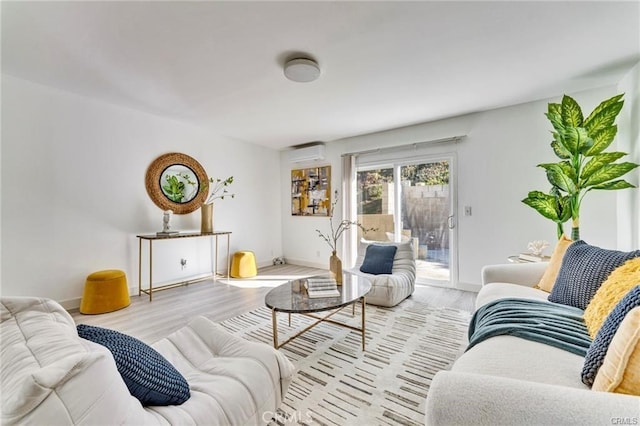 212 Macalester Dr, Walnut, CA 91789 - living room featuring a wall mounted air conditioner, wood finished floors, and baseboards