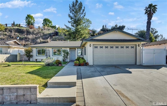 212 Macalester Dr, Walnut, CA 91789 - ranch-style house with stucco siding, concrete driveway, a garage, and a gate