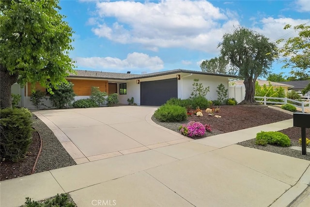26120 Adamor Rd, Calabasas, CA 91302 - view of front of property featuring concrete driveway, a garage, and stucco siding
