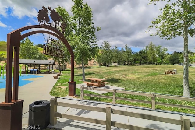 view of community featuring a yard
