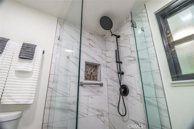full bath with a stall shower and toilet