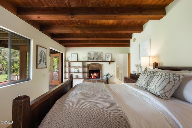 bedroom featuring wood ceiling, beamed ceiling, a fireplace, and access to exterior