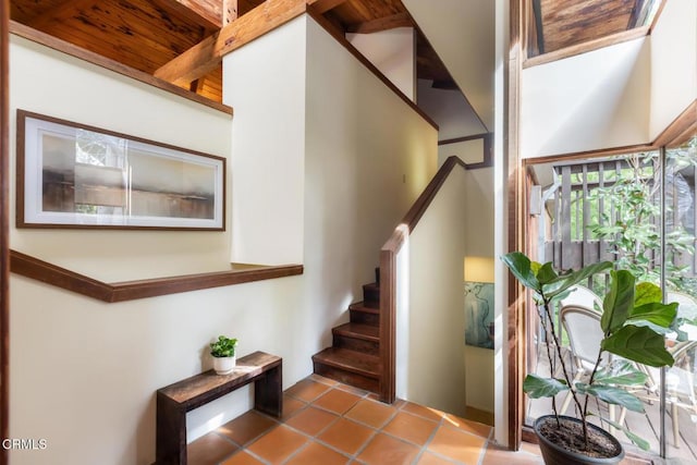 stairway with tile patterned flooring