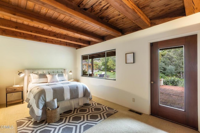 carpeted bedroom featuring wooden ceiling, beam ceiling, and access to exterior